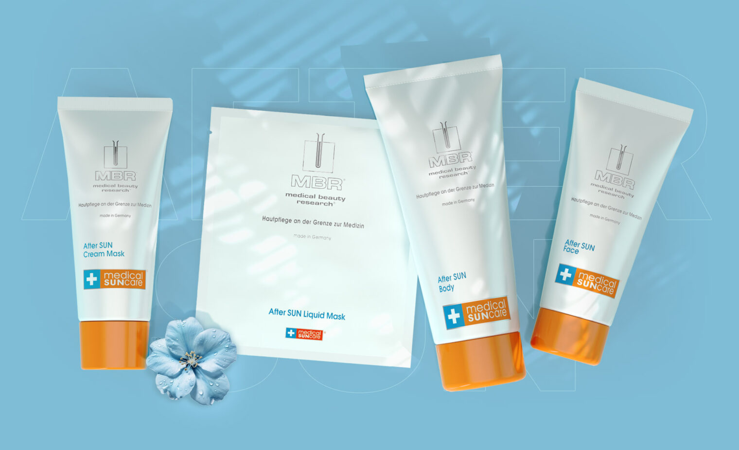 arrangement of the after sun collection products and a blue flower on a blue background